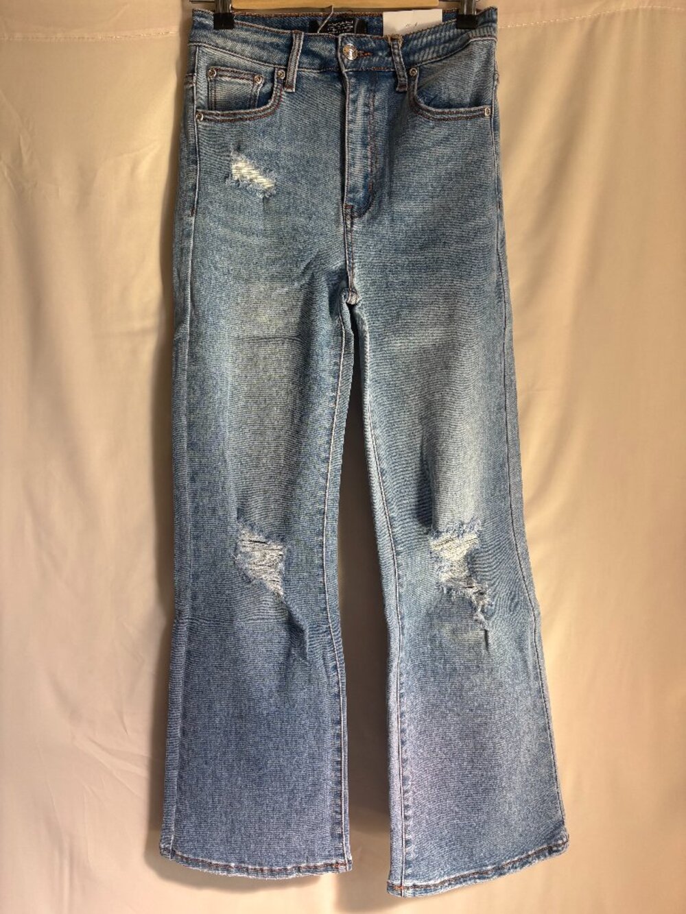 Medium Wash Distressed Flare Jeans – High-Rise Vintage Denim